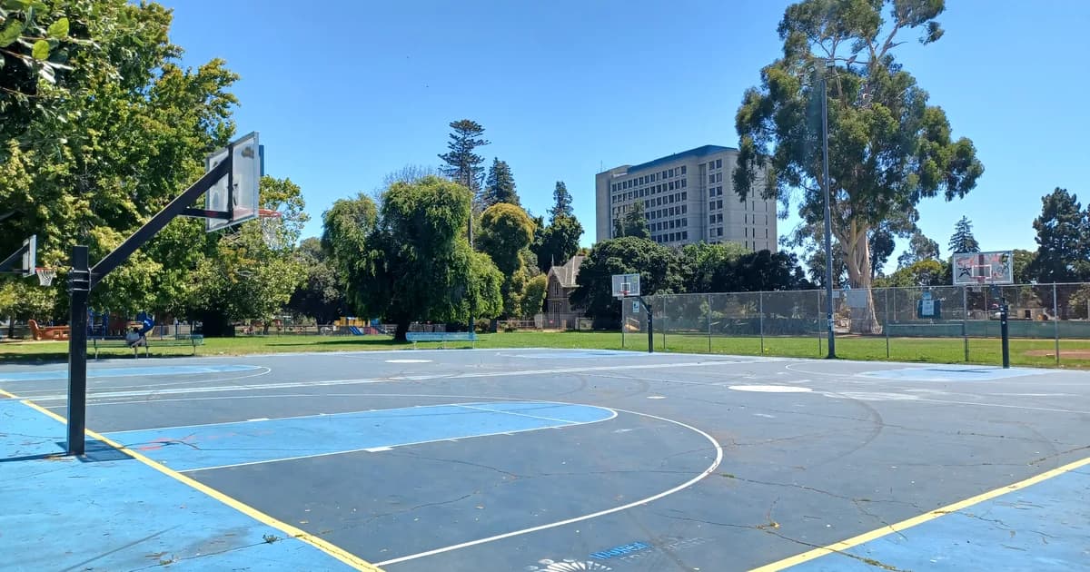 Outdoor basketball courts with blue playing surfaces